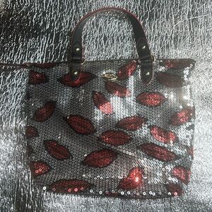 New and never used- Juicy Couture sequin lips purse